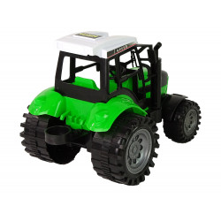 Zöld traktor bálázó dörzshajtással