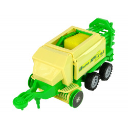 Zöld traktor bálázó dörzshajtással