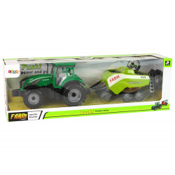 Zöld mezőgazdasági traktor, vetőgép, dörzshajtás