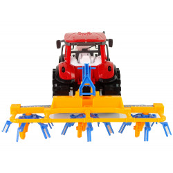 Piros traktor gereblye dörzshajtással